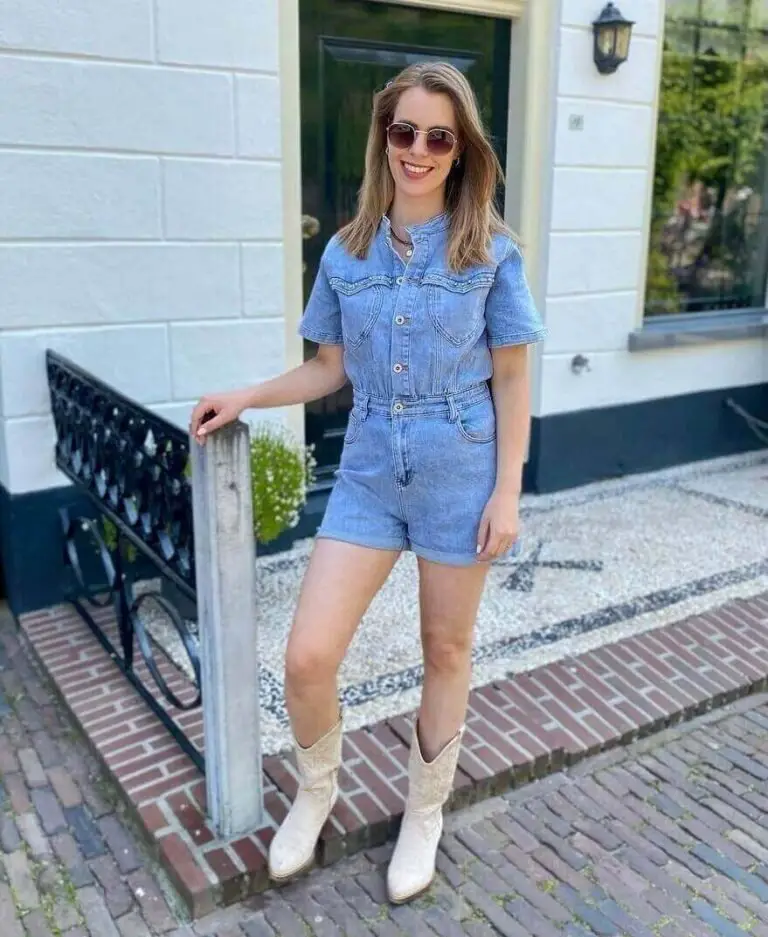 Girl wearing a denim jumpsuit with cowboy boots