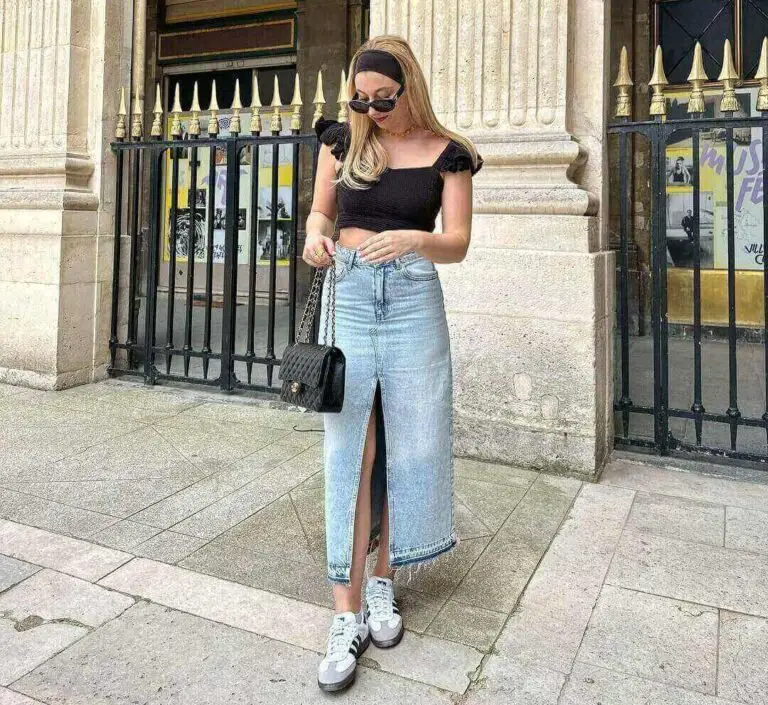Girl wearing a denim skirt with a flowy off the shoulder top