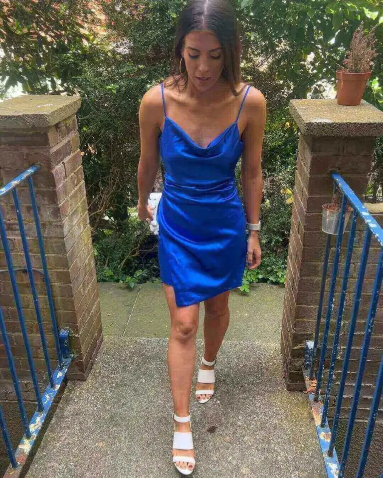 Girl wearing whote heels with navy blue dress